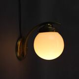 Pair of Art Deco wall sconces in brass and opaline glass, Europe, 1930s