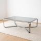 Chrome coffee table with a glass top.