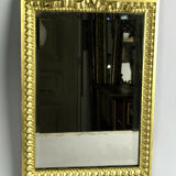Miroir biseauté en bronze doré de style Louis XVI  37cm x 23,5cm