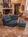 Vintage corner armchair and its pouf.
