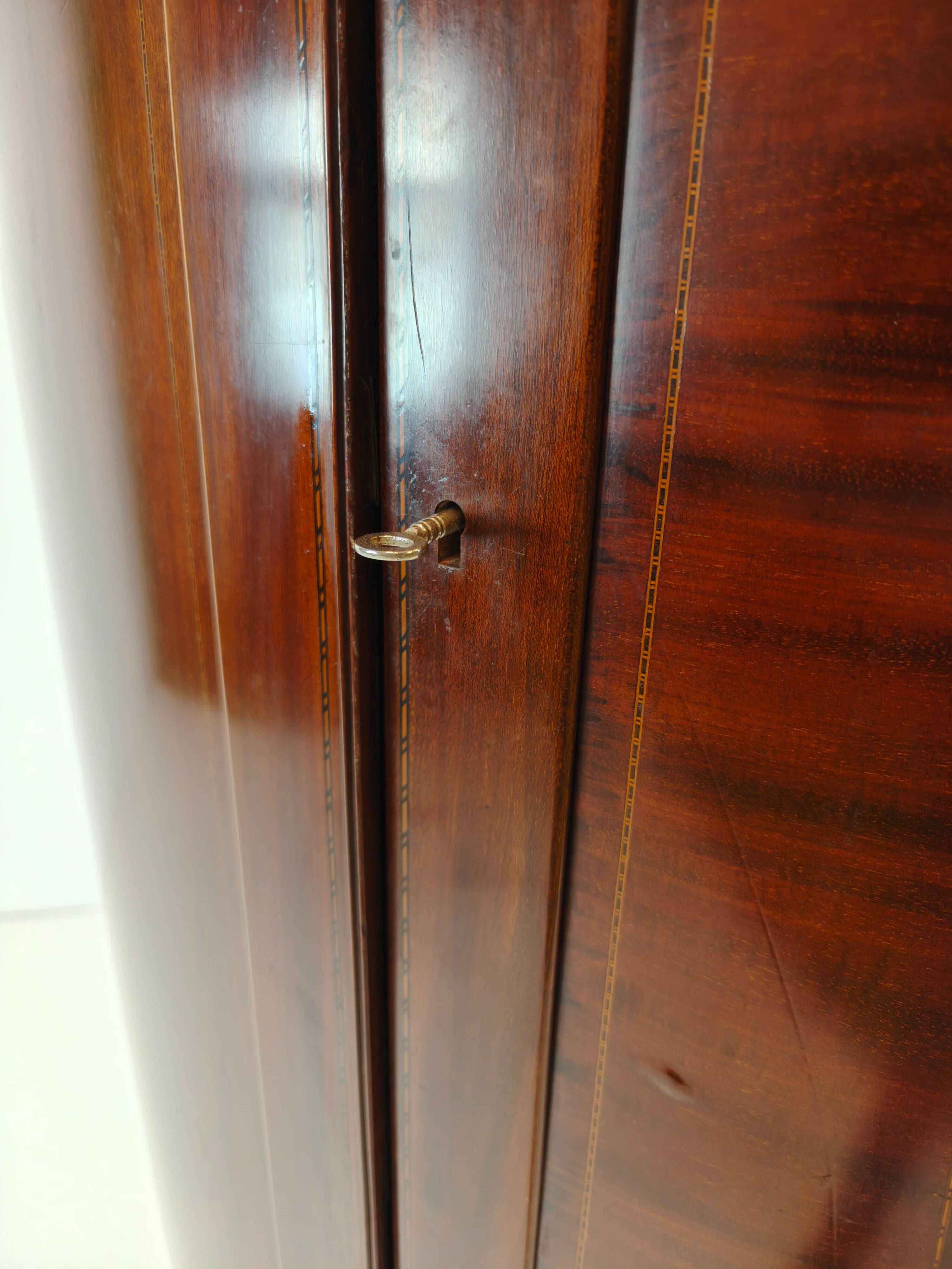 Edwardian mahogany bow-fronted wardrobe by Maple & Co