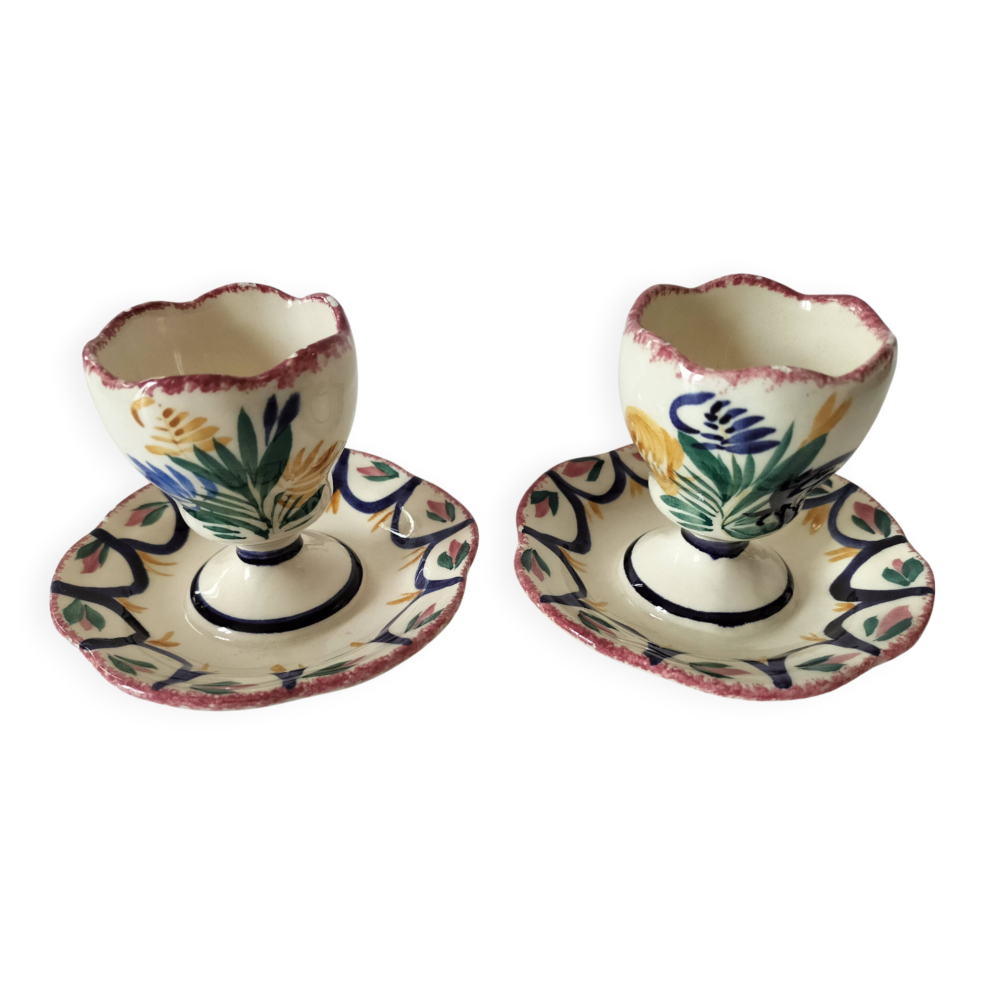 Pair of HB Quimper egg cups with integrated pedestal base, floral decoration