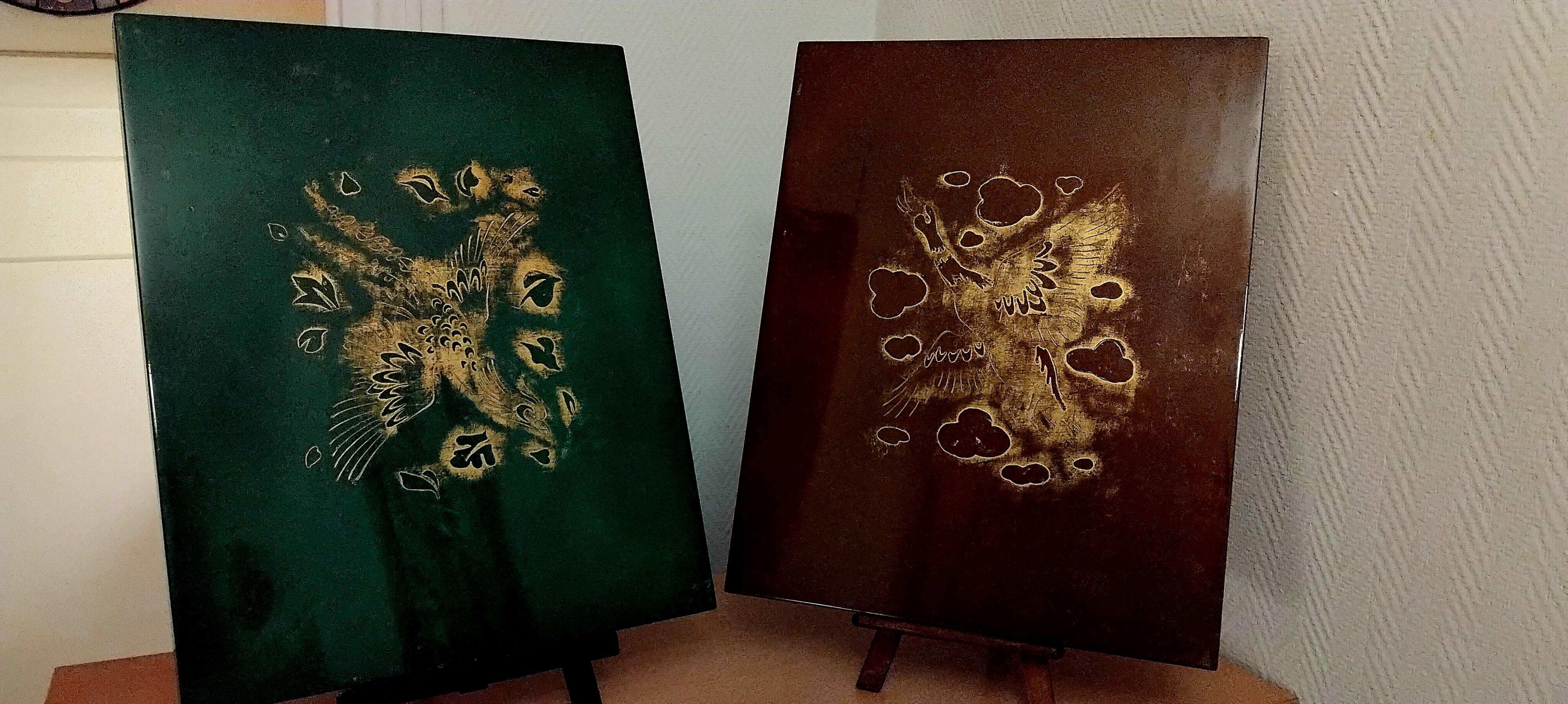 Two panels in lacquer and gold by Pierre Bobot.