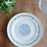 Round antique earthenware dish with floral decoration