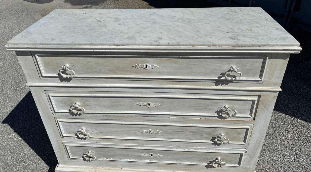 Old chest of drawers in bleached wood with white marble top