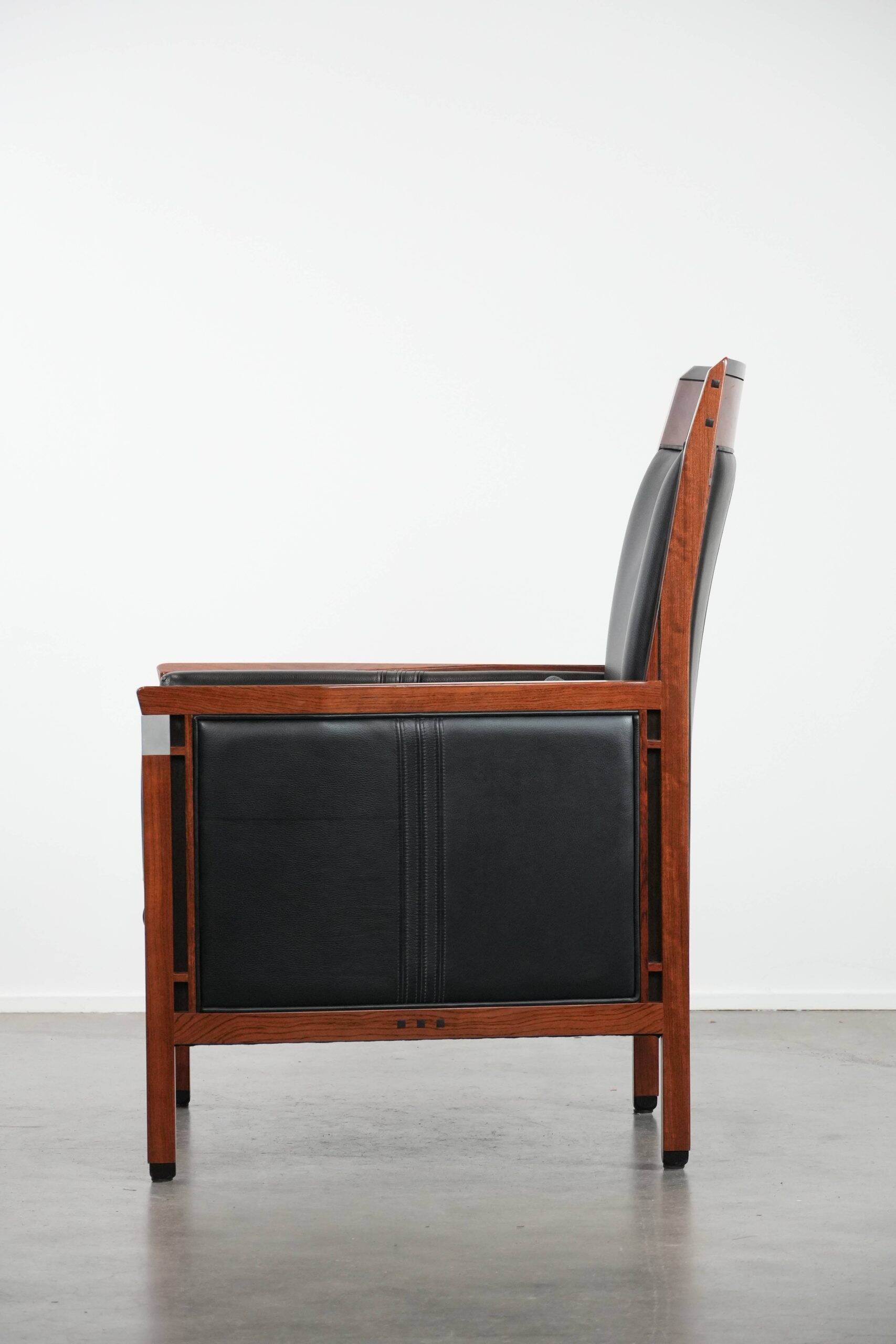 Beautiful and very comfortable black Art Deco design armchair