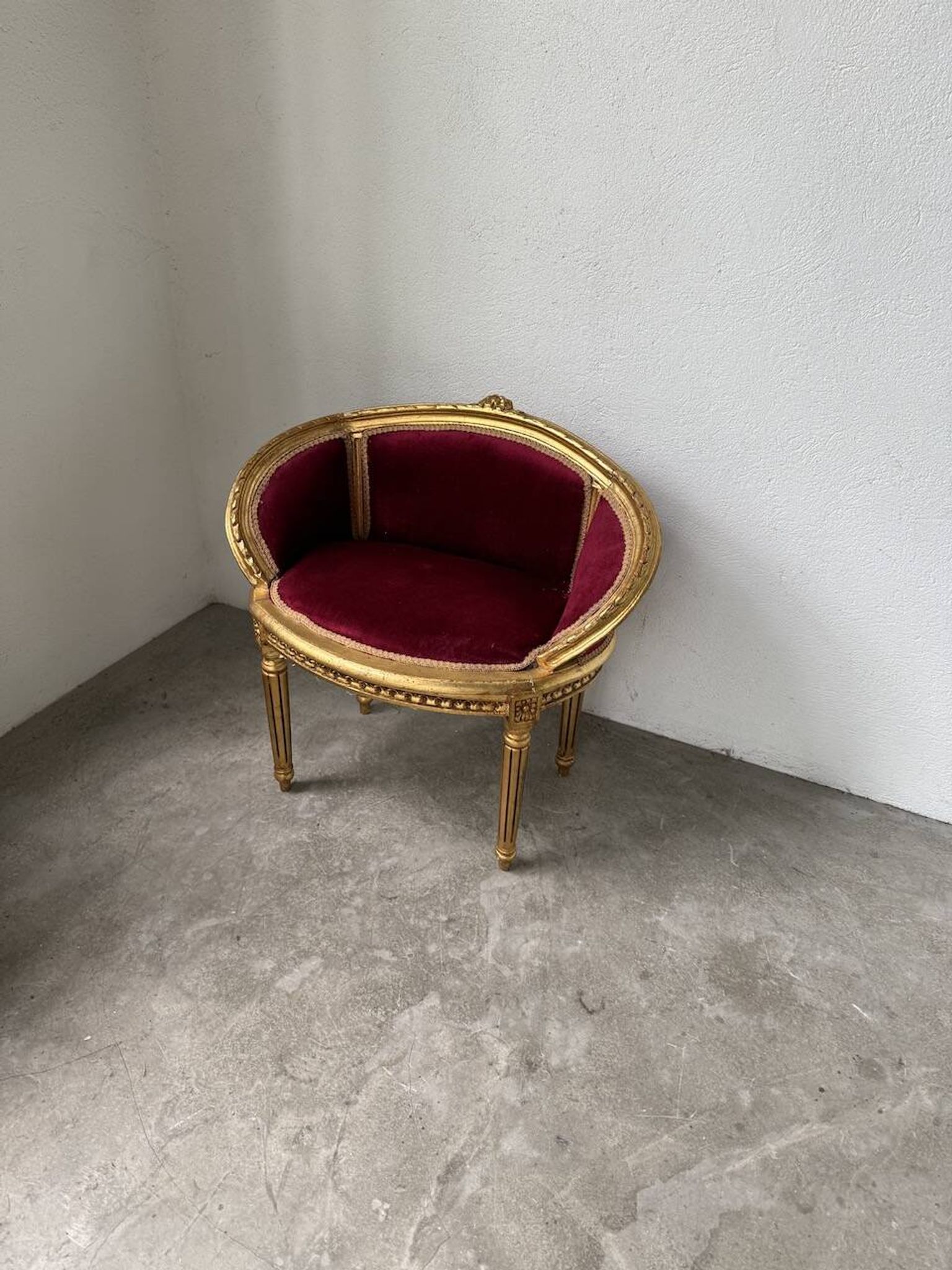 Louis XVI gilt wood and red velvet armchair