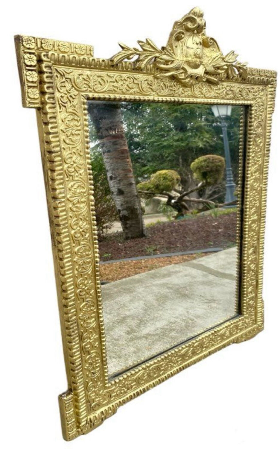 19th-century antique mirror in carved gilded wood, Napoleon style.
