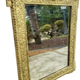 19th-century antique mirror in carved gilded wood, Napoleon style.
