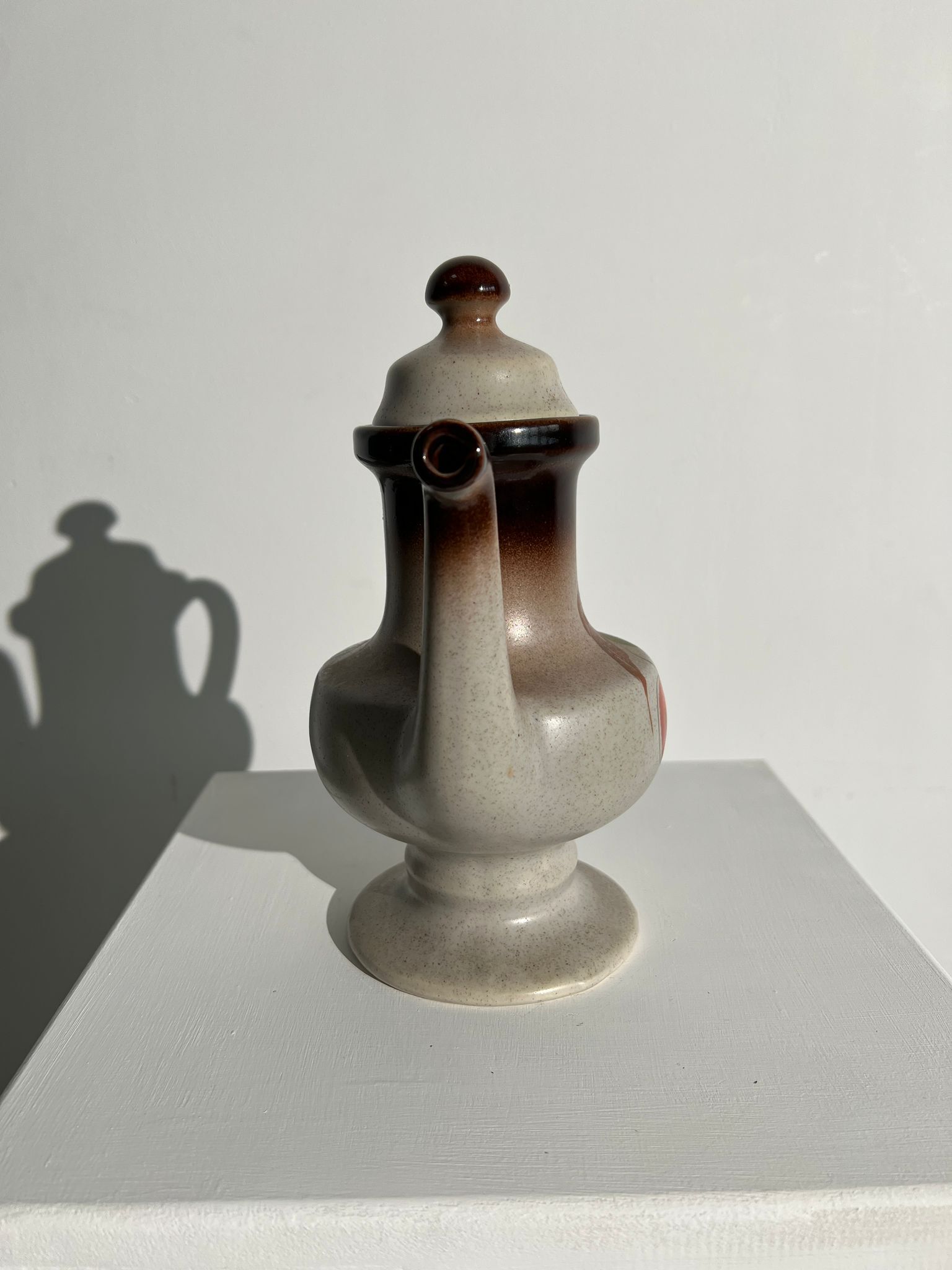 Vintage stoneware teapot with flower and fruit patterns