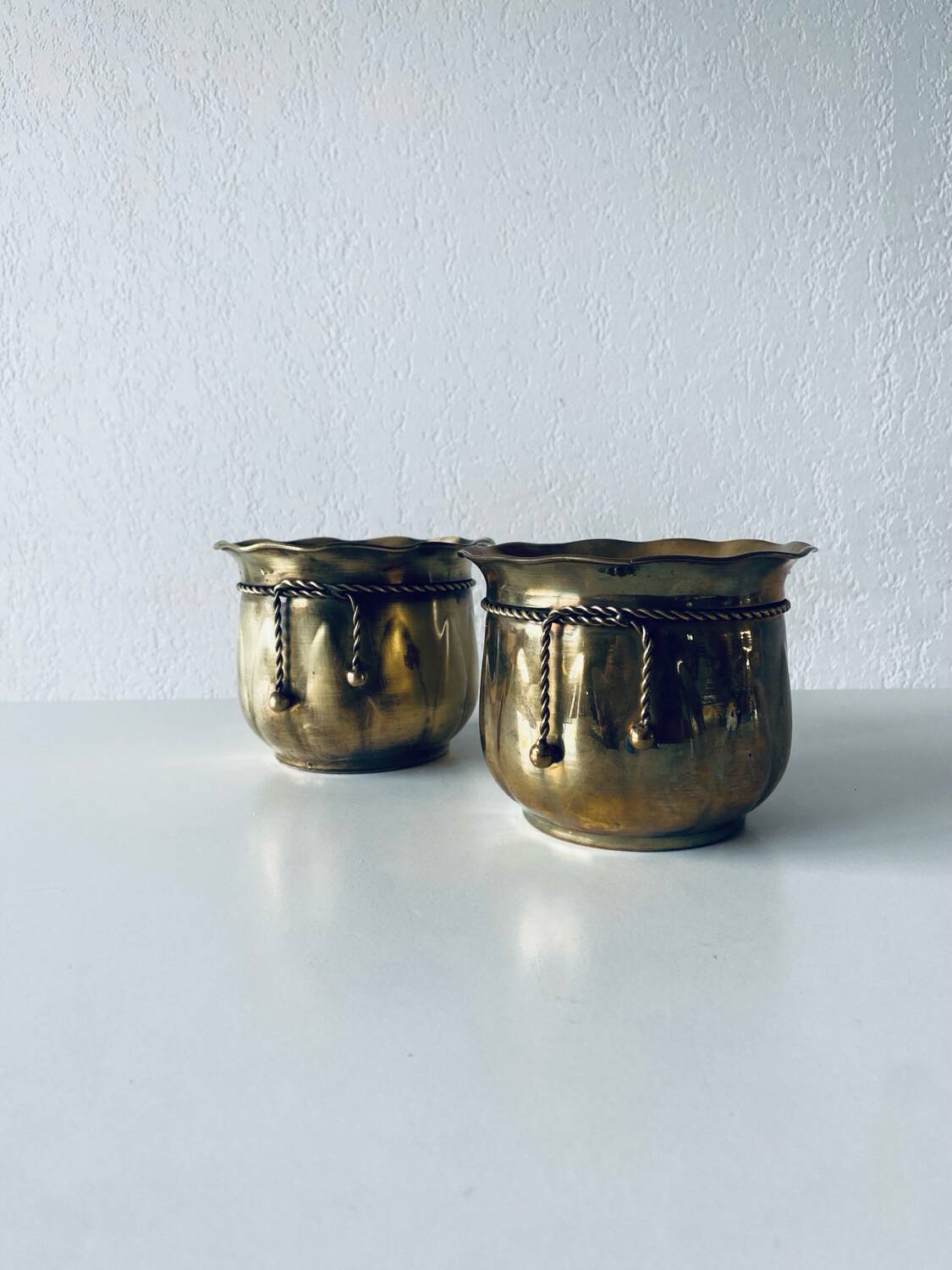 Pair of brass cord pot covers