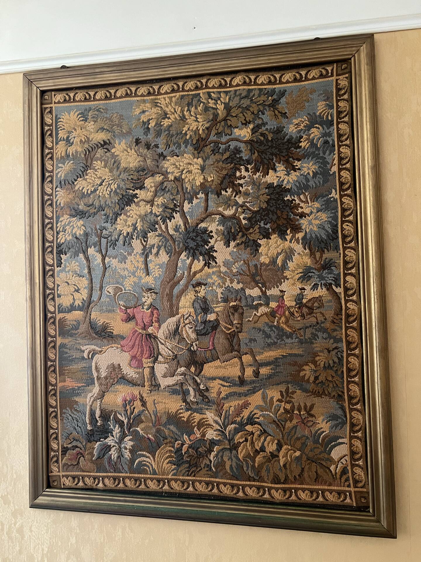 Antique wall tapestry in Aubusson style with a gilded moulded frame.
