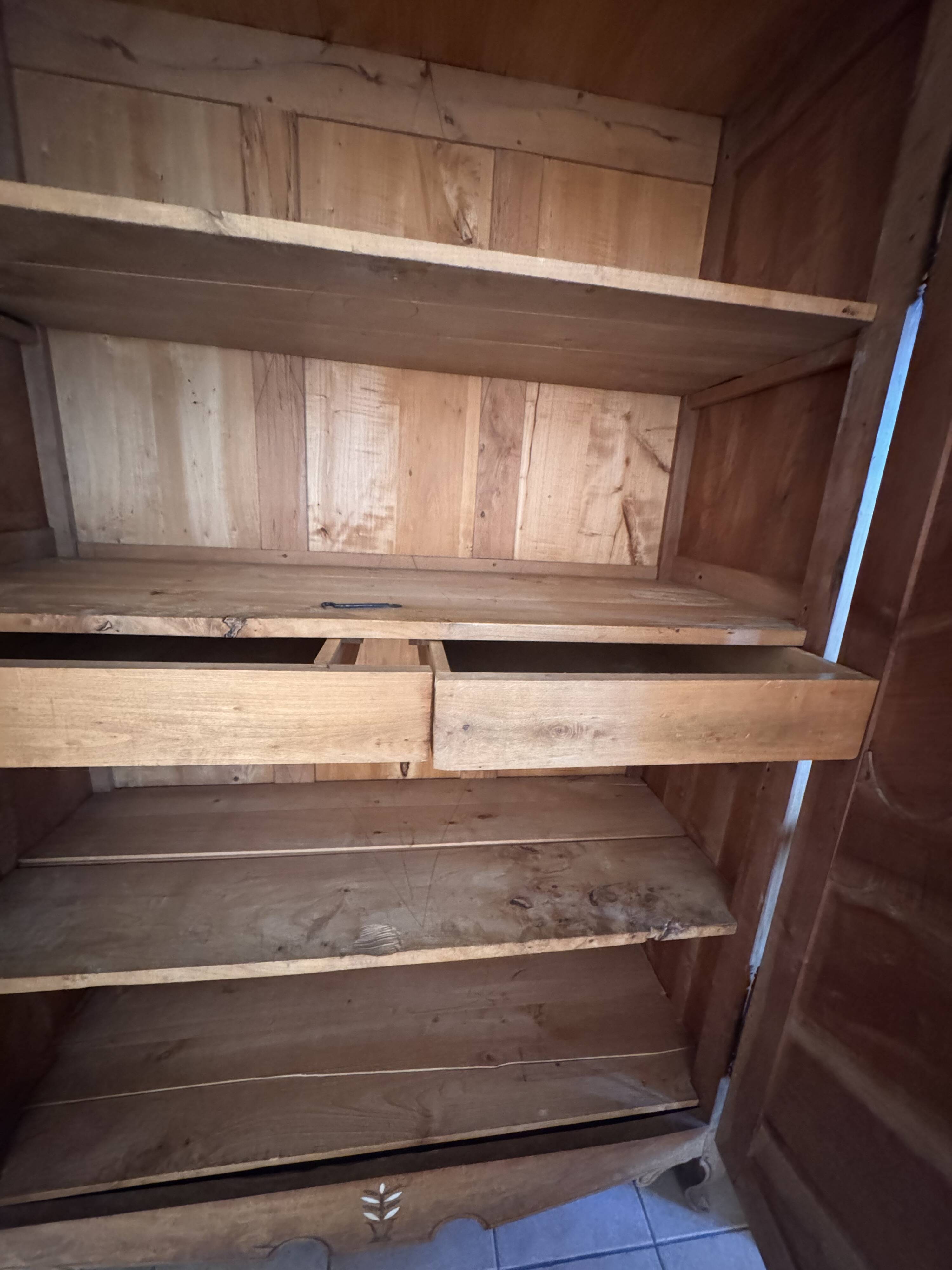 Antique 2-door wardrobe made of solid wood with shelves and drawers.