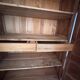 Antique 2-door wardrobe made of solid wood with shelves and drawers.