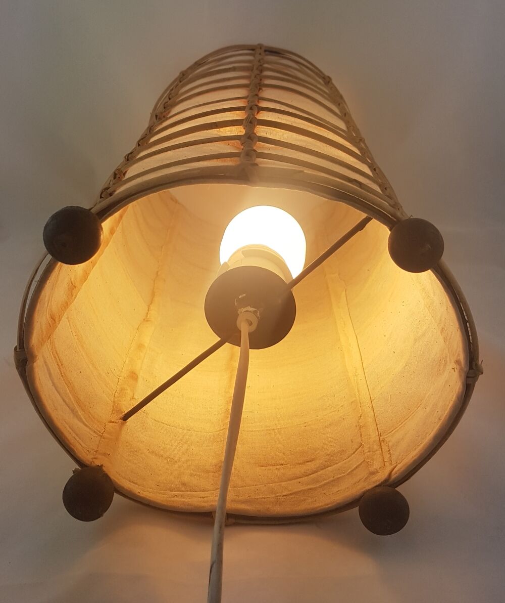 Lamp to be laid in rattan and fabric