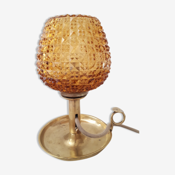 Vintage amber diamond tip lamp mounted on candle holder