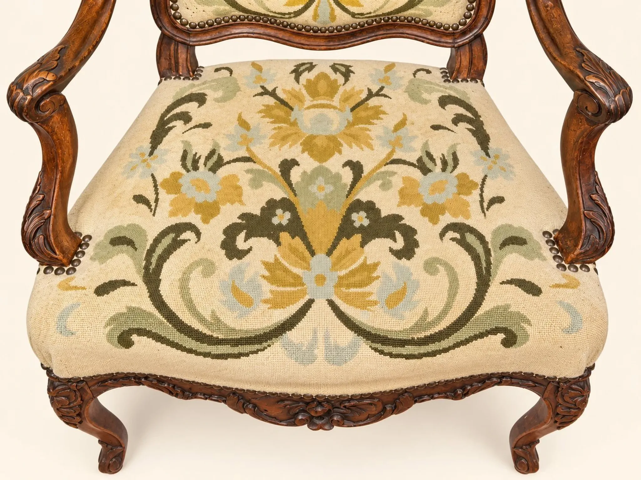 Louis XV cabriolet armchair, carved walnut, petit point tapestry, 18th century.