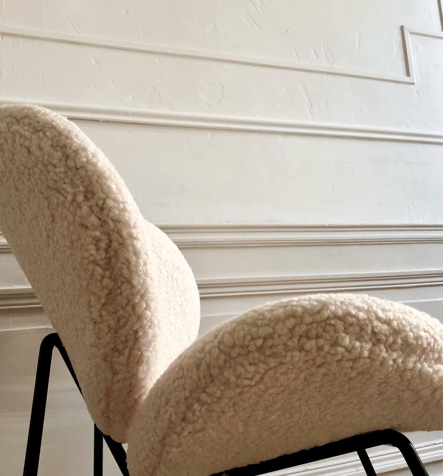 Contemporary design armchair in sheepskin
