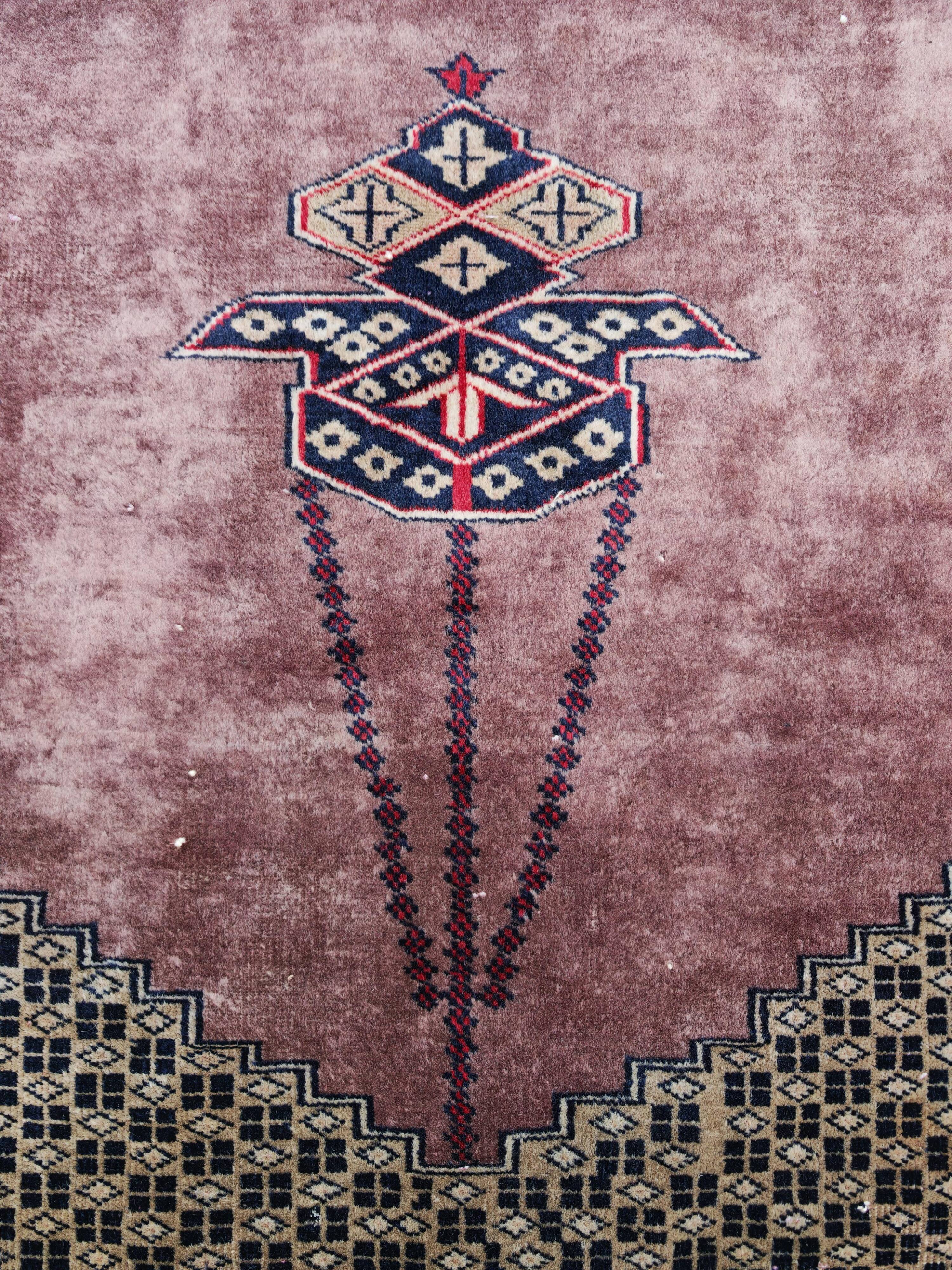 Vintage Anatolian prayer rug made of hand-knotted wool.
