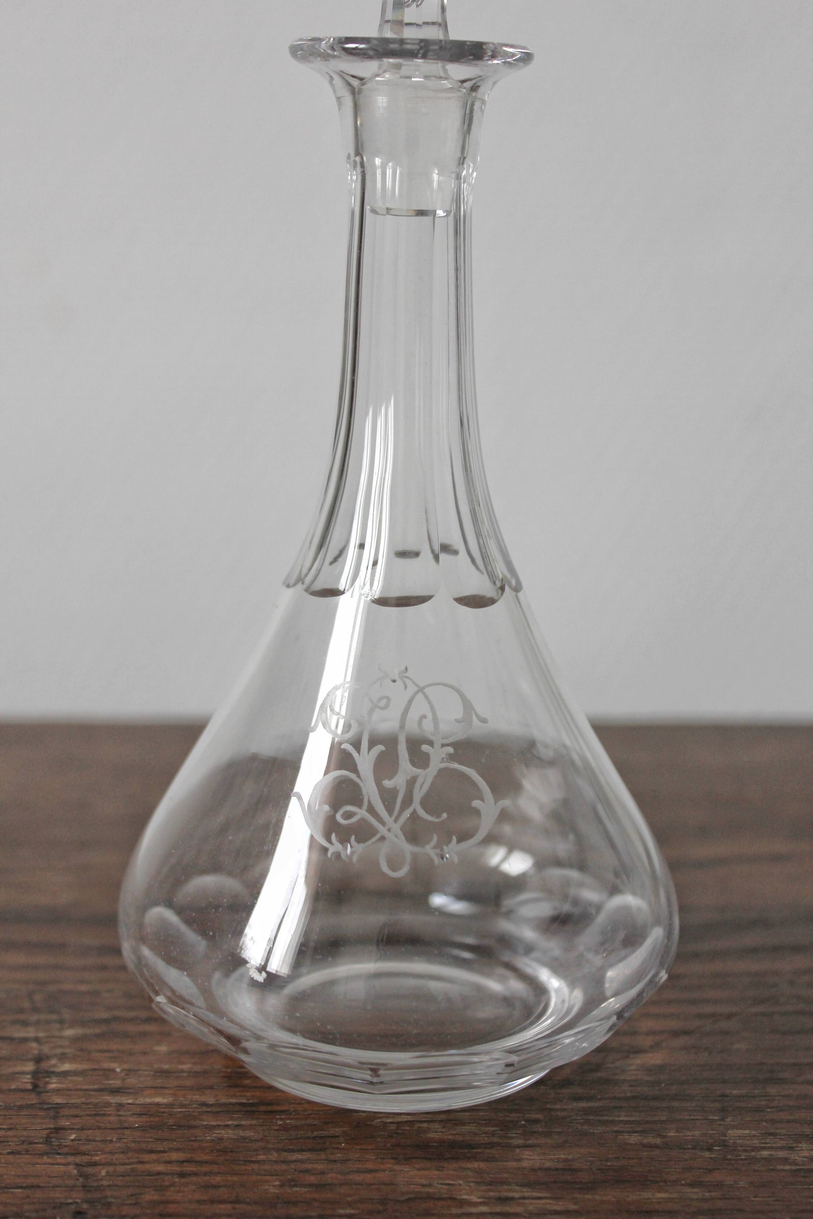 Antique crystal liqueur decanter with engraved monogram and flat ribs