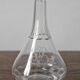 Antique crystal liqueur decanter with engraved monogram and flat ribs