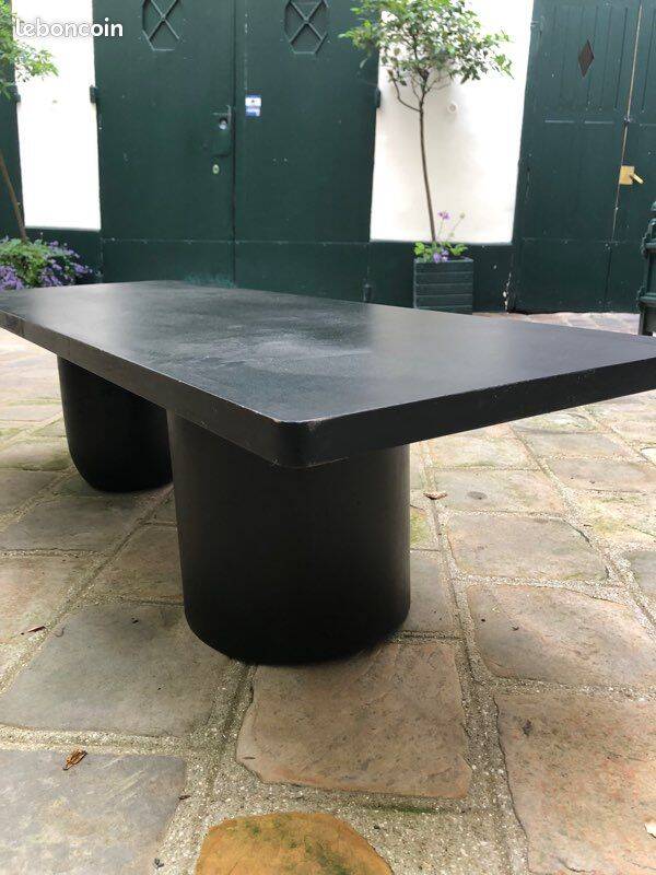 Rectangular coffee table in stained black wood with ball and cylindrical legs.