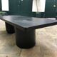Rectangular coffee table in stained black wood with ball and cylindrical legs.