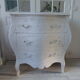 Curved patinated chest of drawers pearl grey waxed finish