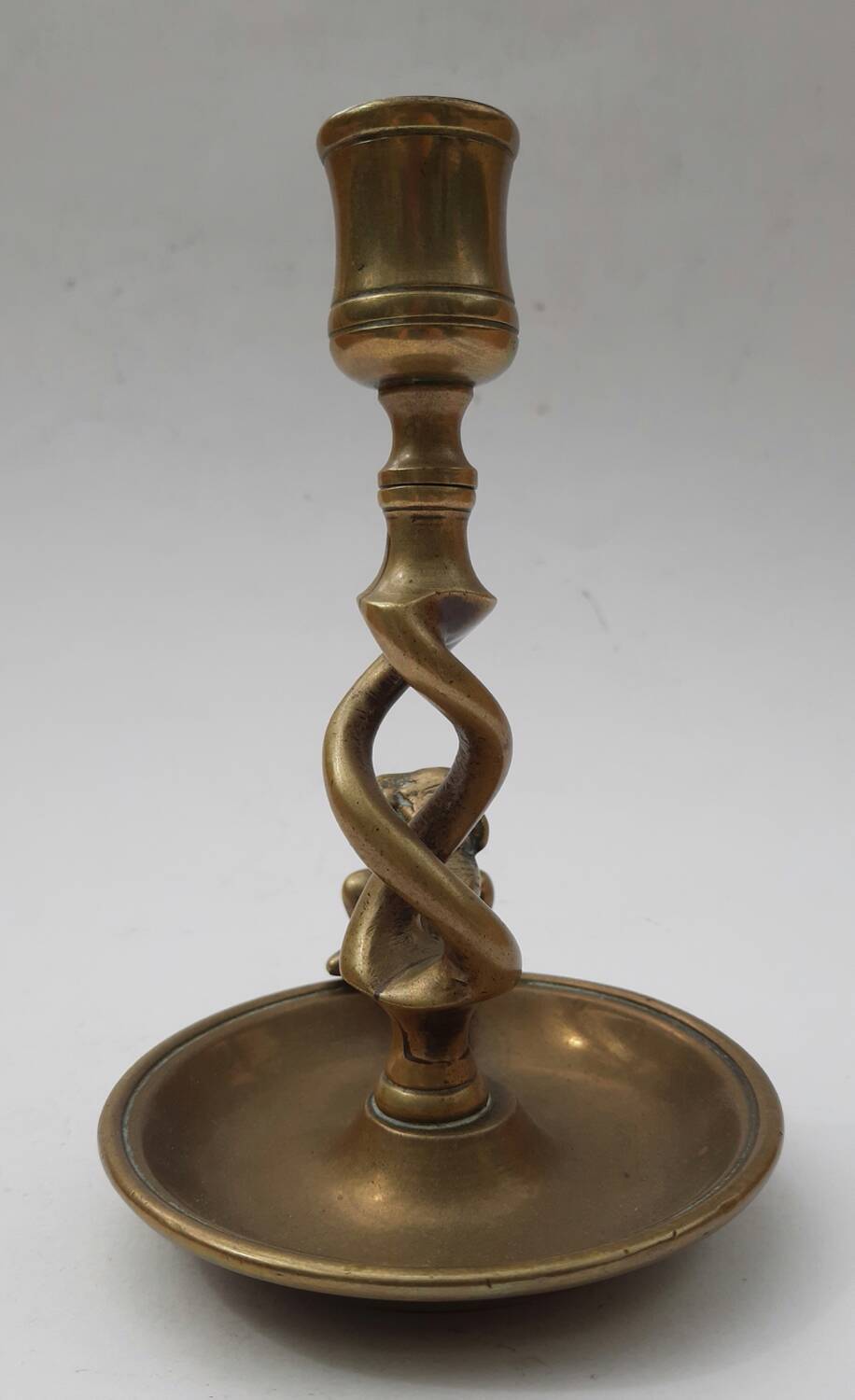 Antique bronze candlestick with dragon-shaped handle from the 17th century