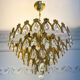 Vintage chandelier in gilded brass with crystal pendants.