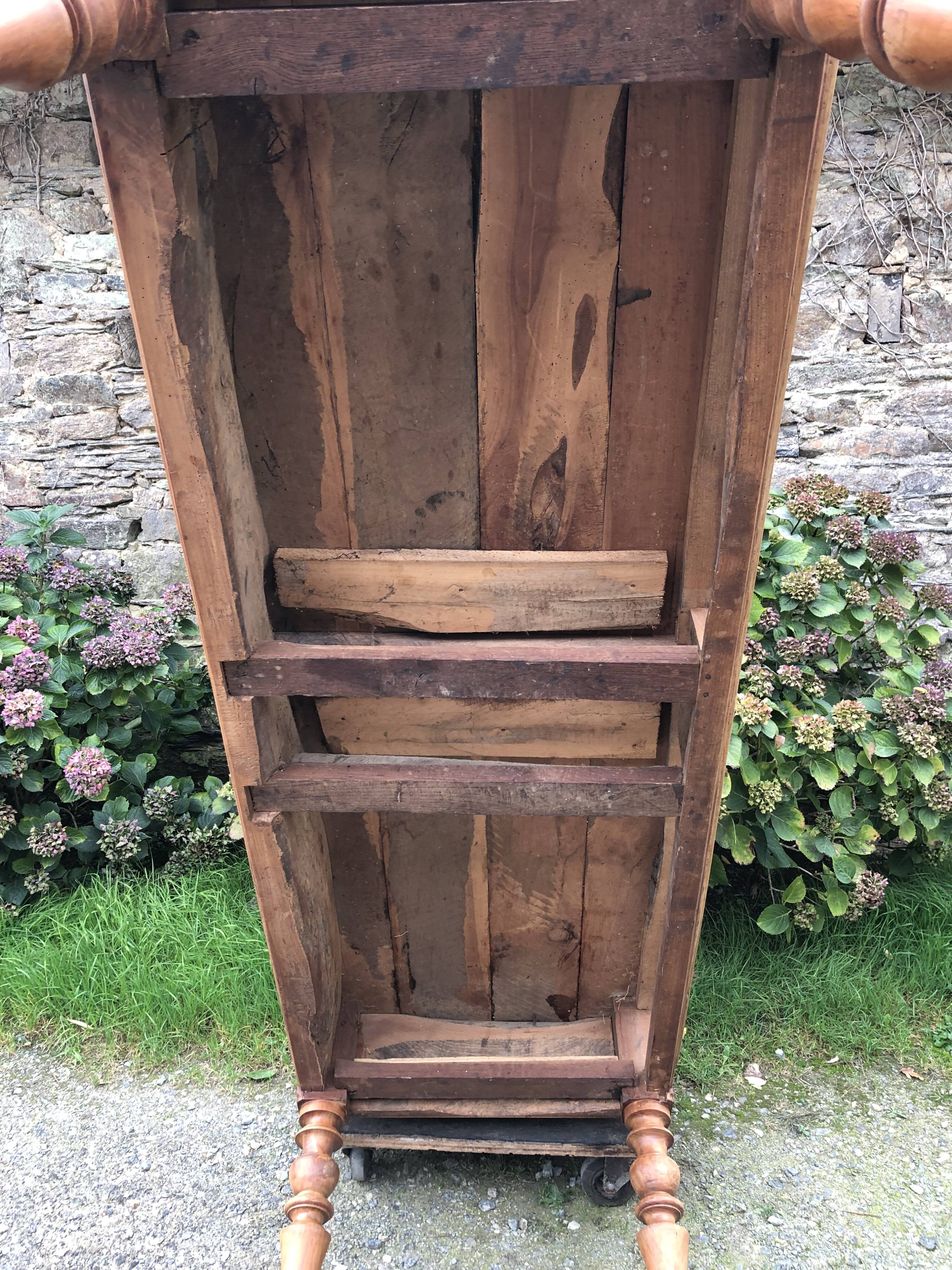 Antique Louis Philippe style farm table in solid cherry wood with 2 drawers and turned base.