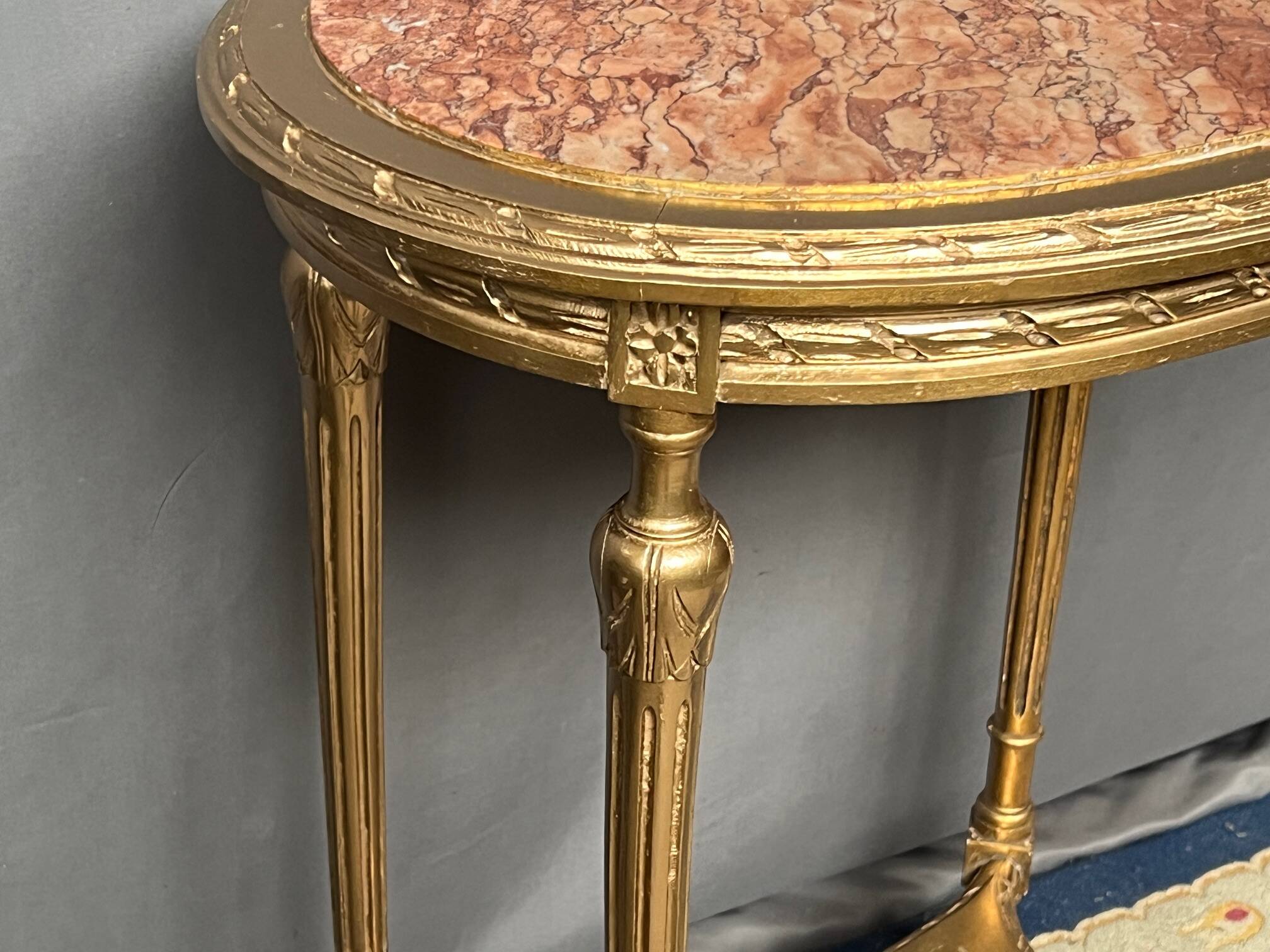 French Louis XVI style giltwood table. Marble top. Late 19th century.