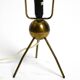 Mid Century tripod brass table lamp with a wrapped nylon strip lampshade
