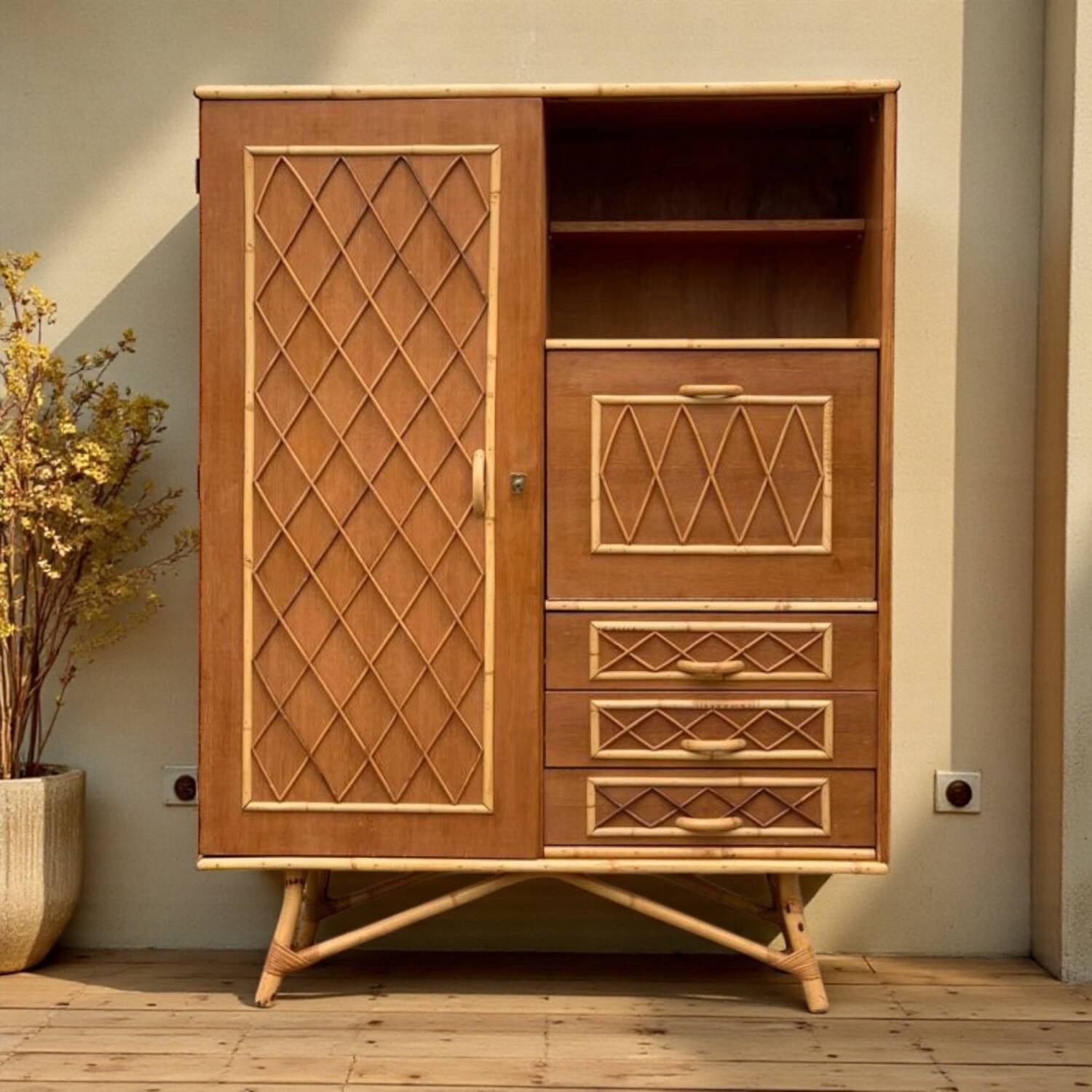Rattan wardrobe with tapered legs from the 1960s.