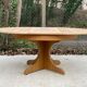 Round extendable Scandinavian dining table in Baumann style oak with central leg