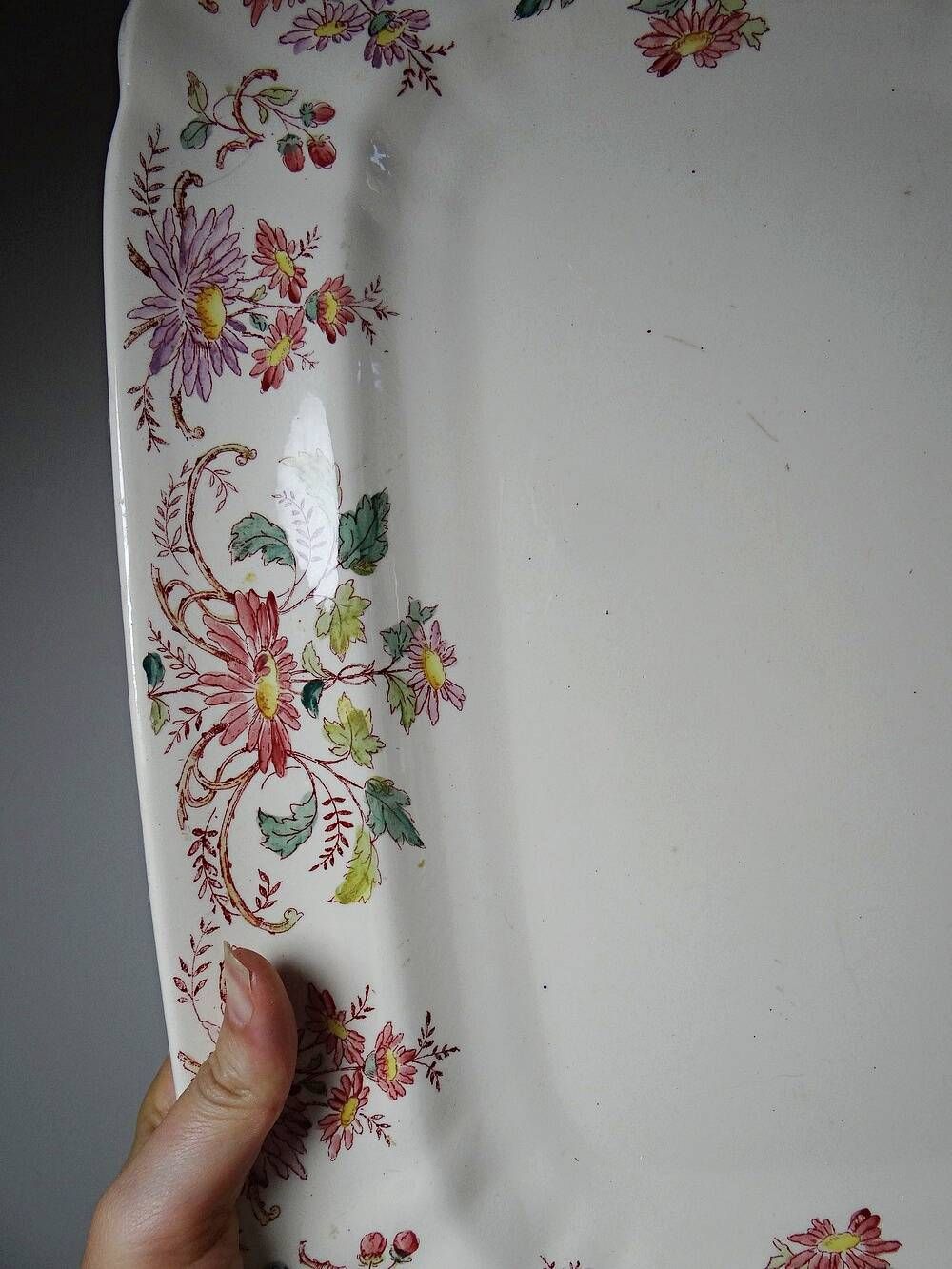 Antique Longchamp serving platter with polychrome daisies in ironstone.