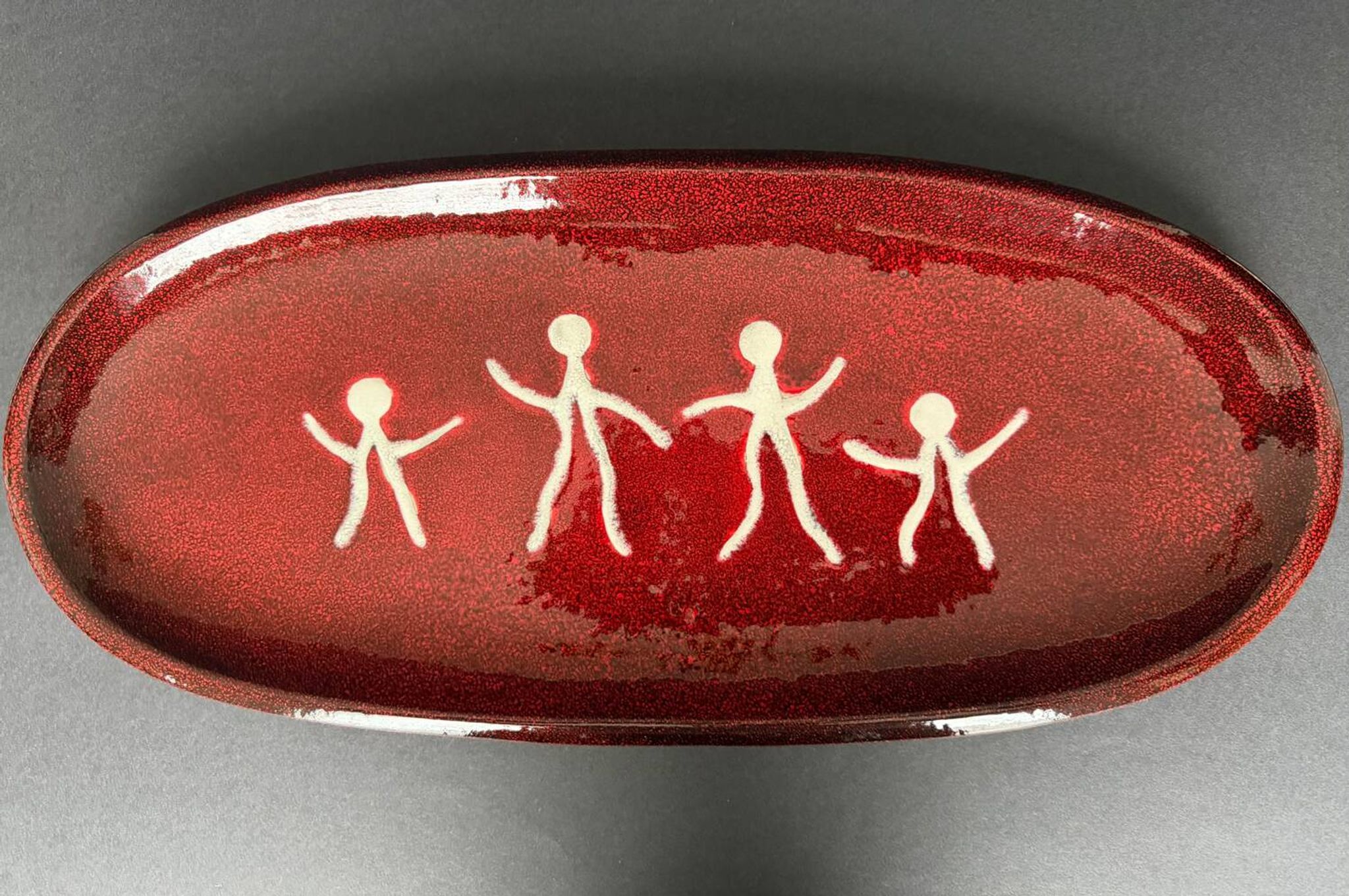 Large red ceramic dish