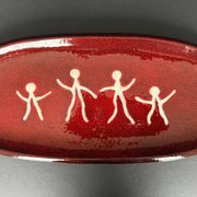 Large red ceramic dish