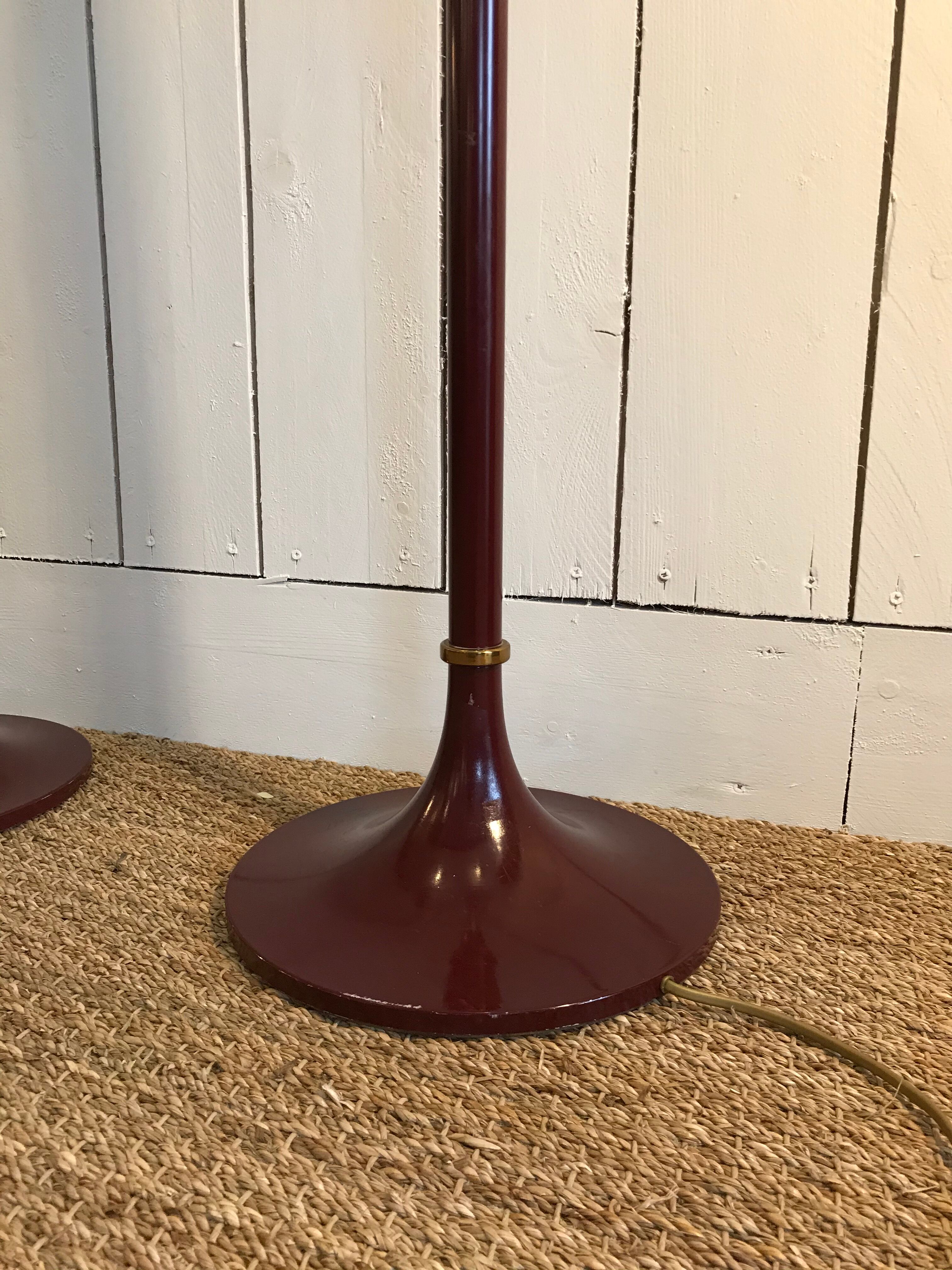 Pair of red enamelled metal floor lamps