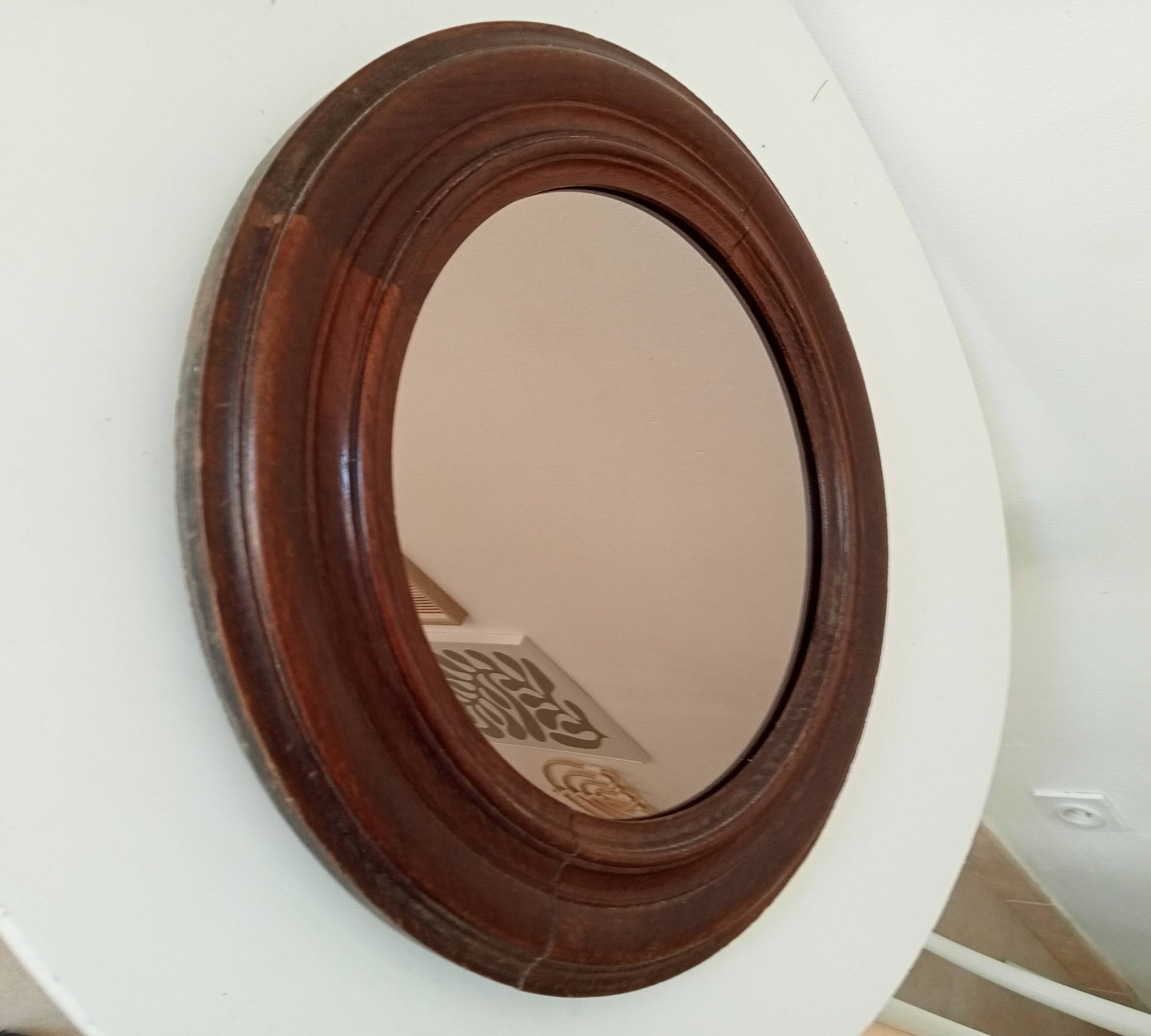 Antique round wooden mirror