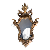 Antique scalloped mirror with pediment decorated with cherubs – carved gilded wood