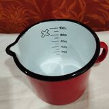 graduated measuring pitcher in red enamelled sheet metal