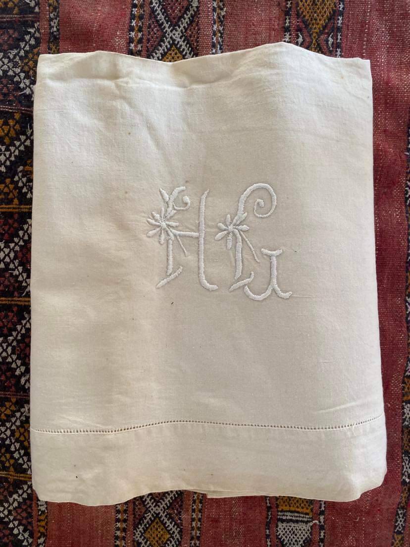 Drap en metis monogramme HG.