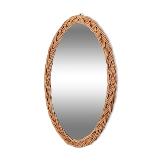 Oval mirror in vintage wicker