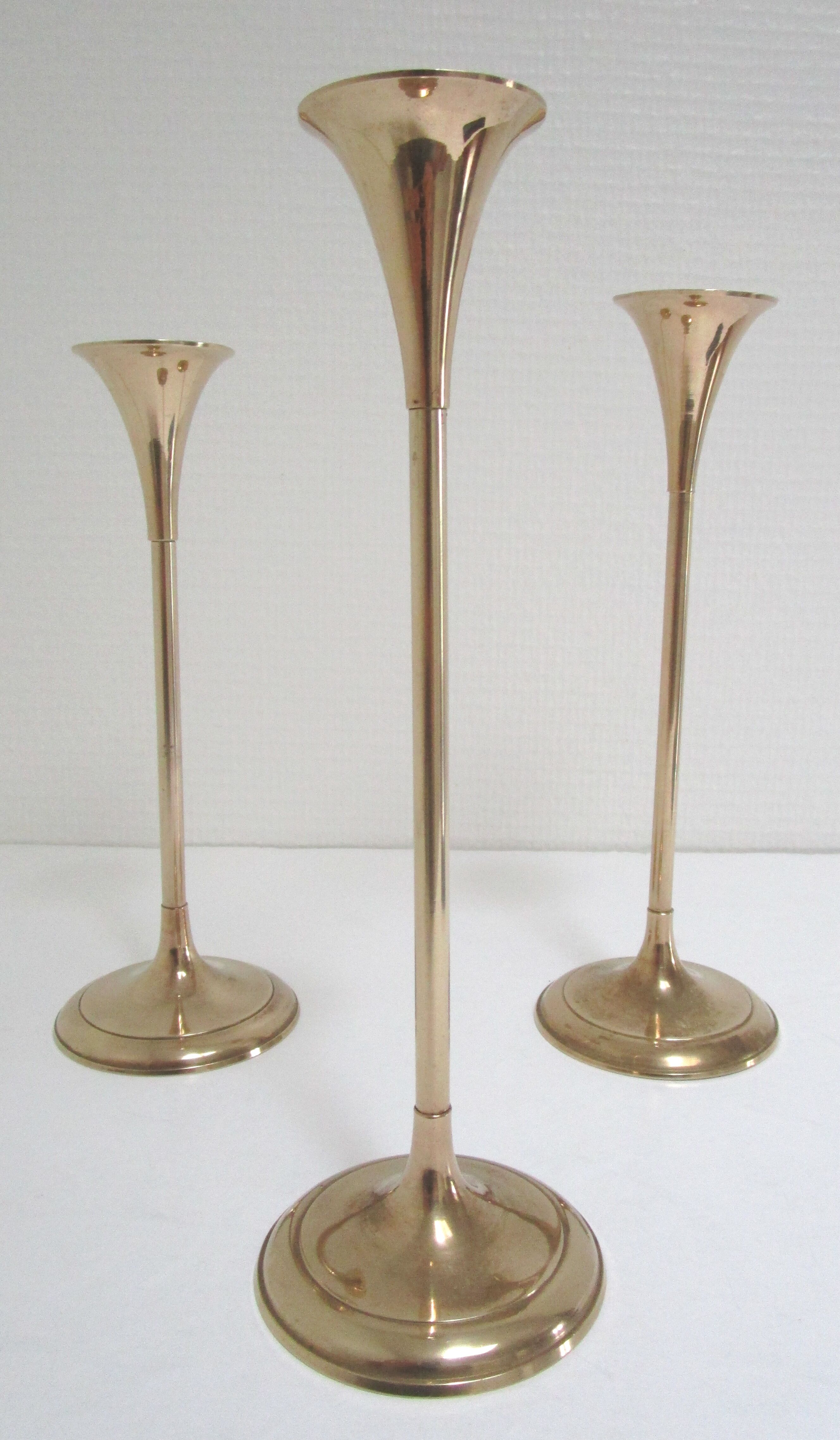Trio of brass scandinavian candlesticks