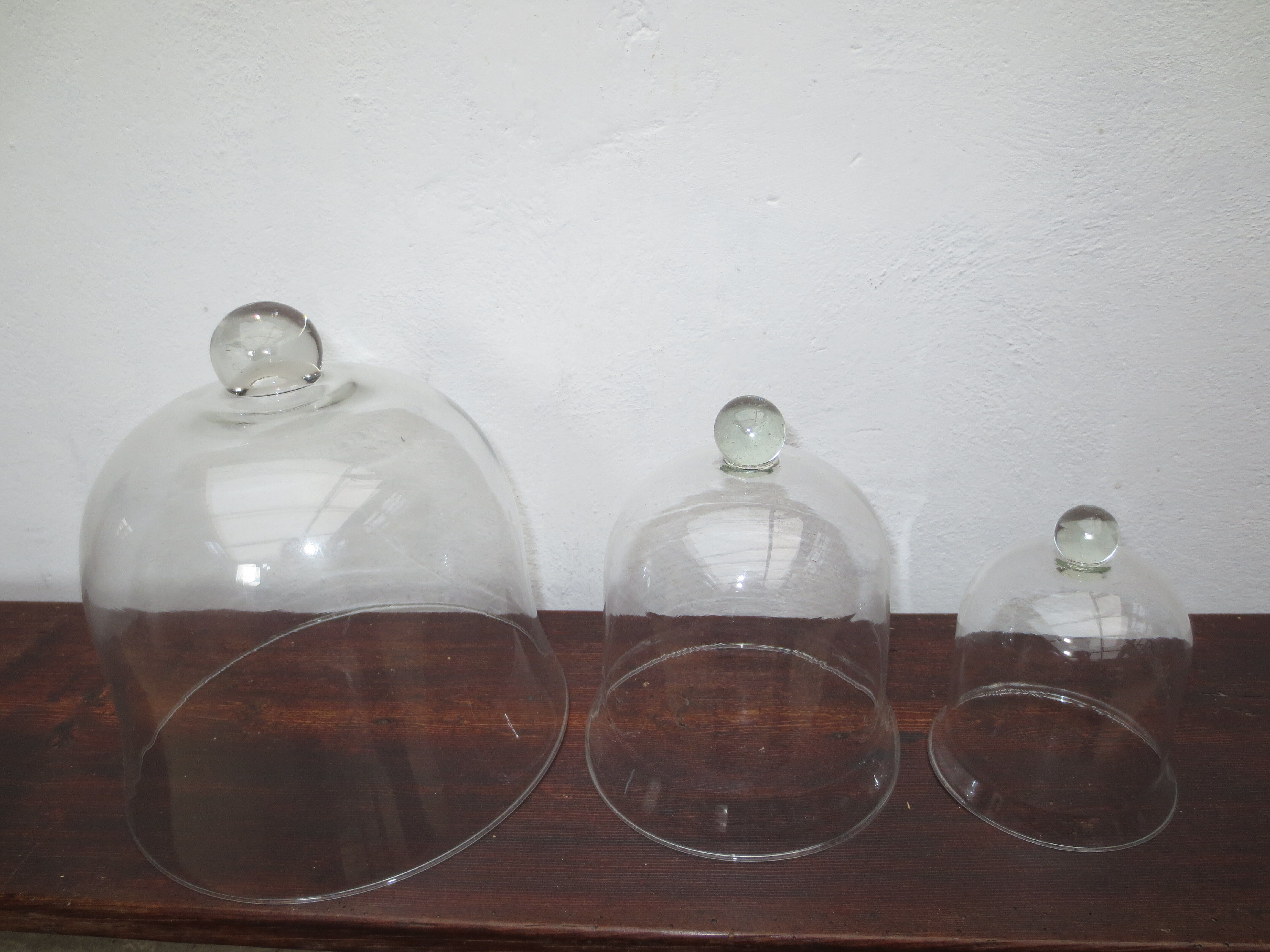 trio of old bells in transparent glass