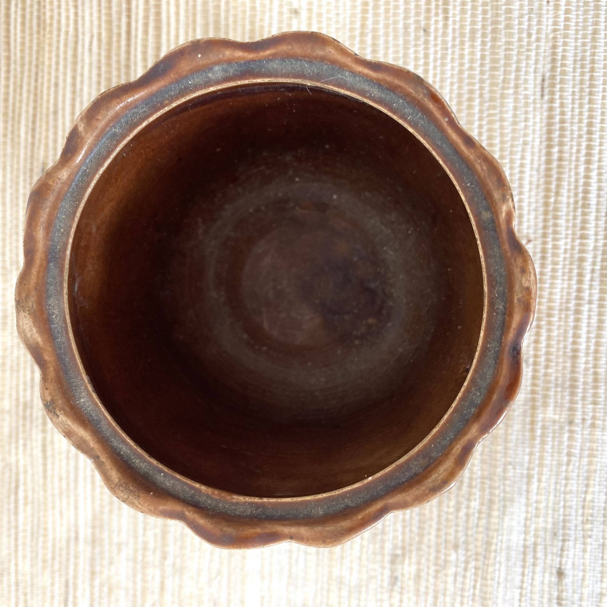Antique slip pot with acorn decoration