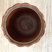 Antique slip pot with acorn decoration