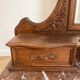 Antique carved wooden dressing table with marble and mirror.