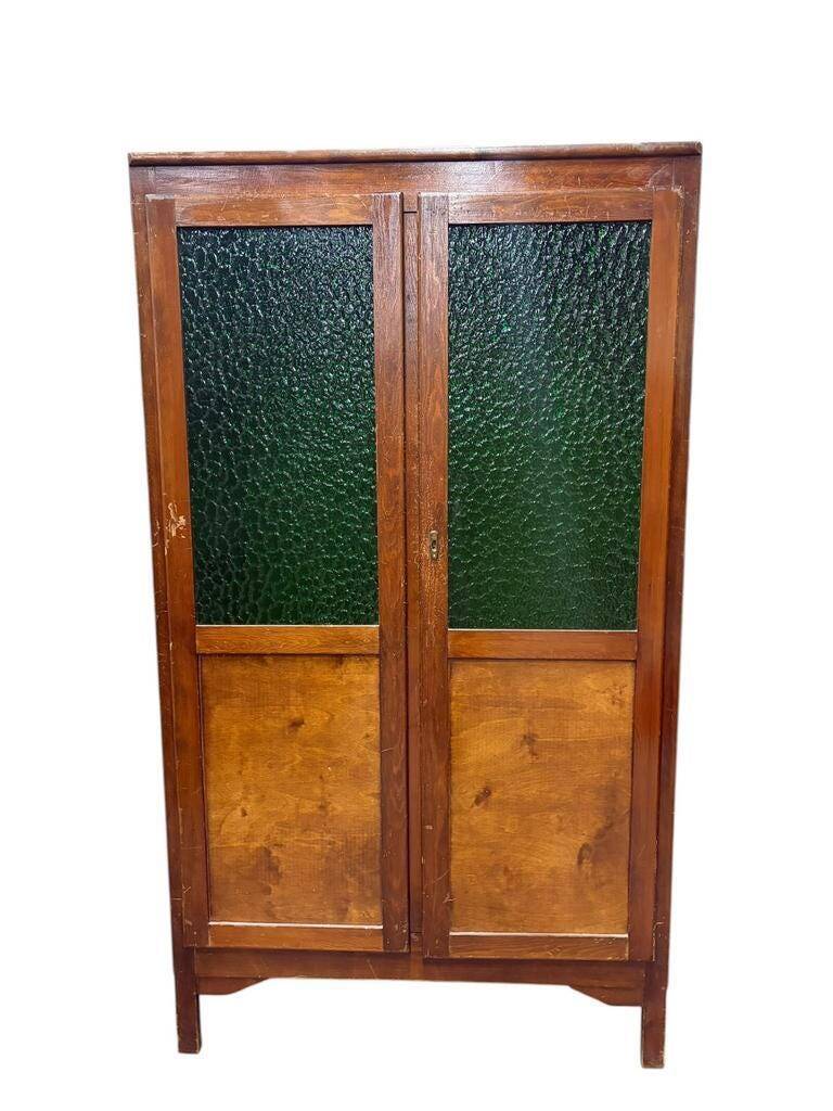 Vintage wooden display cabinet with green glass.